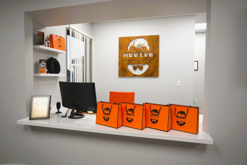 Revive front desk with branded welcome bags and product shelves