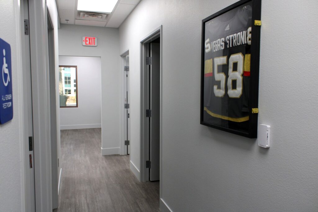 Treatment room hallway at Revive Mens Hair Clinic