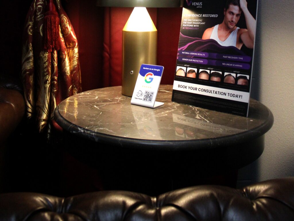 Marble side table with consultation materials in the Gentlemens Lounge