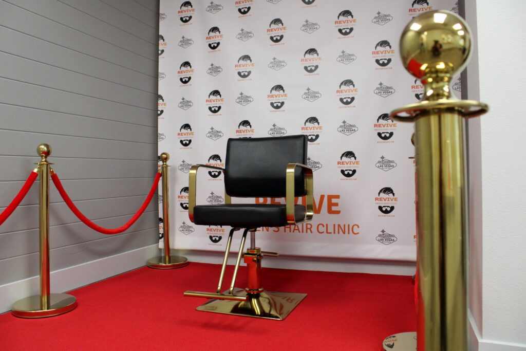 Consultation chair on the red carpet at Revive Mens Hair Clinic